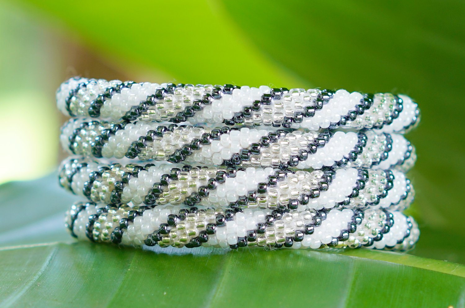 Handmade glass bead bracelet from Nepal, featuring a roll design. Also known as a beaded bracelet, seed bead bracelet, beach glass bracelet, or sea glass bracelet.