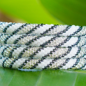 Handmade glass bead bracelet from Nepal, featuring a roll design. Also known as a beaded bracelet, seed bead bracelet, beach glass bracelet, or sea glass bracelet.
