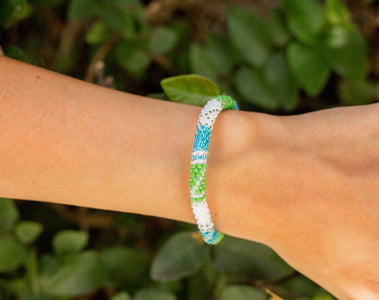 Handmade glass bead bracelet from Nepal, featuring a roll design. Also known as a beaded bracelet, seed bead bracelet, beach glass bracelet, or sea glass bracelet.