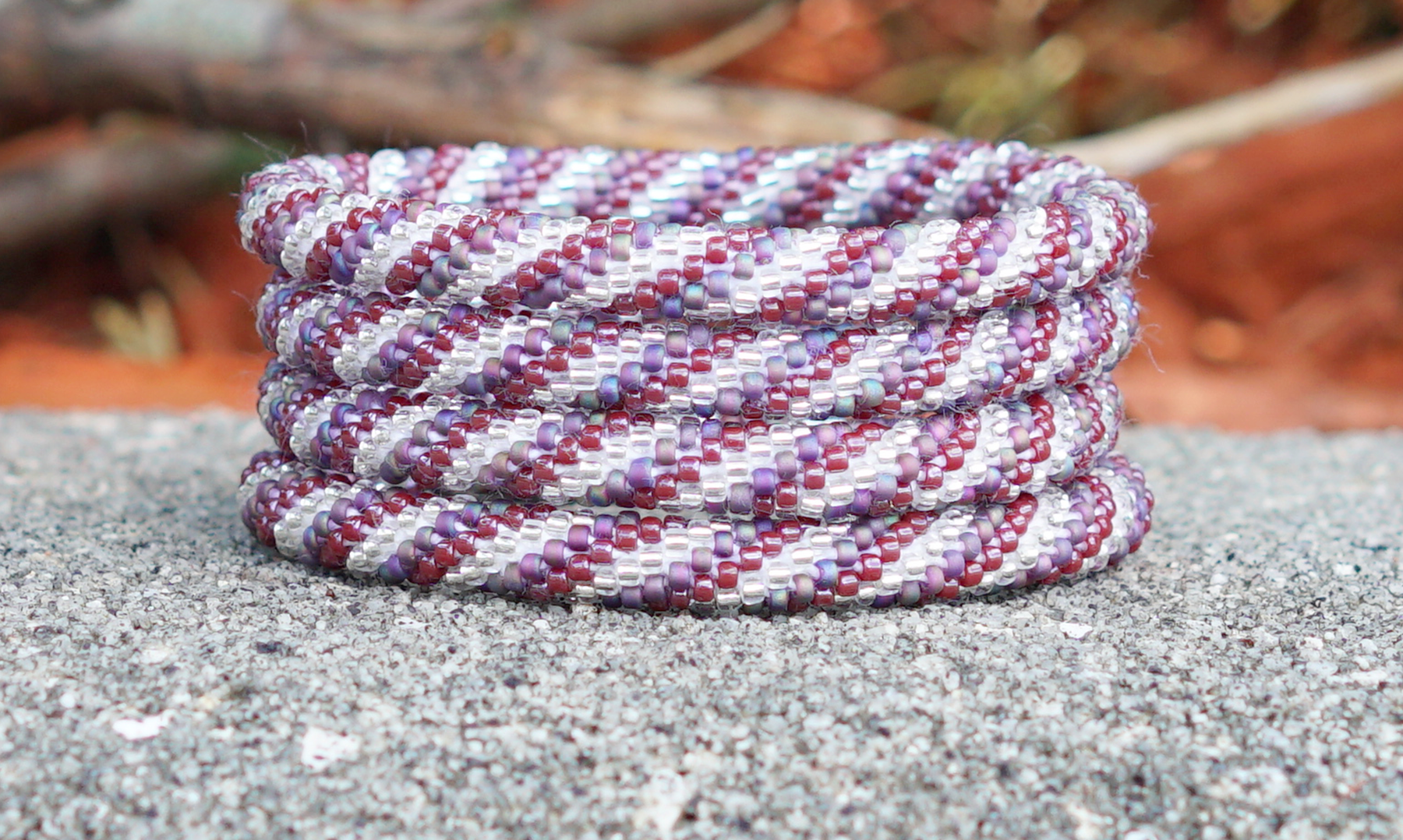 Handmade glass bead bracelet from Nepal, featuring a roll design. Also known as a beaded bracelet, seed bead bracelet, beach glass bracelet, or sea glass bracelet.