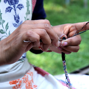 Sashka Co handmade beaded friendship bracelet with black and mixed confetti glass beads in a half-and-half design. Crafted in Nepal by skilled artisans.