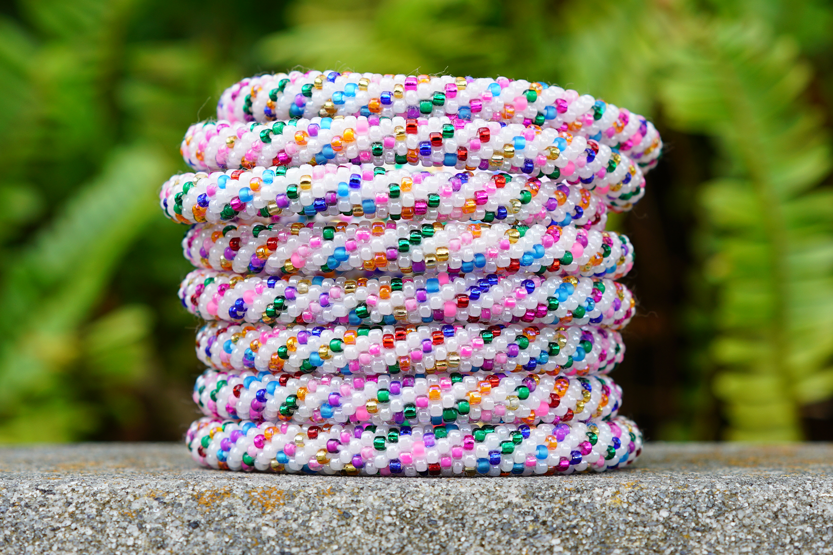 Handmade glass bead bracelet from Nepal, featuring a roll design. Also known as a beaded bracelet, seed bead bracelet, beach glass bracelet, or sea glass bracelet.