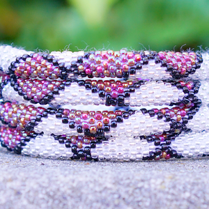 Handmade glass bead bracelet from Nepal, featuring a roll design. Also known as a beaded bracelet, seed bead bracelet, beach glass bracelet, or sea glass bracelet.