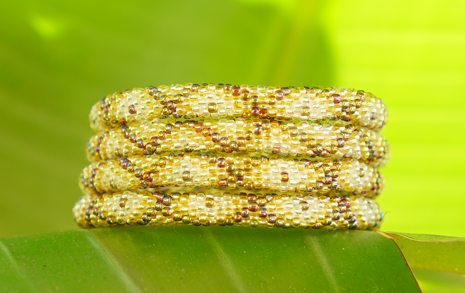 Handmade glass bead bracelet from Nepal, featuring a roll design. Also known as a beaded bracelet, seed bead bracelet, beach glass bracelet, or sea glass bracelet.