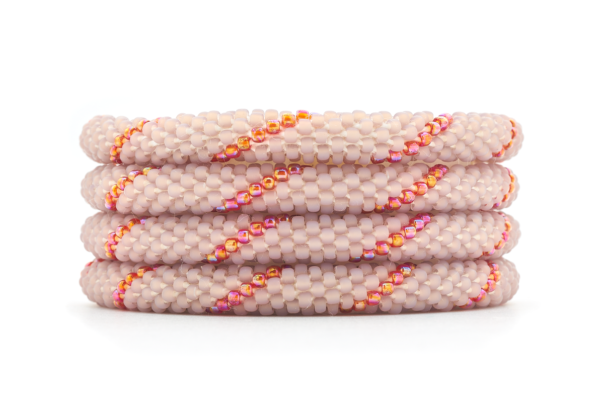 Sashka Co. handmade glass beaded friendship bracelet with mauve and iridescent red glass beads in a spiral pattern. Crafted in Nepal by skilled artisans.