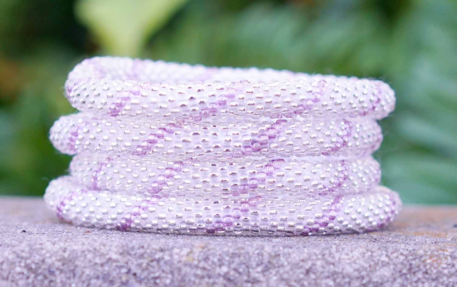 Handmade glass bead bracelet from Nepal, featuring a roll design. Also known as a beaded bracelet, seed bead bracelet, beach glass bracelet, or sea glass bracelet.