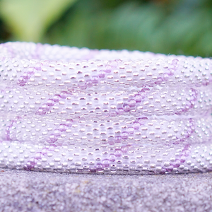 Handmade glass bead bracelet from Nepal, featuring a roll design. Also known as a beaded bracelet, seed bead bracelet, beach glass bracelet, or sea glass bracelet.