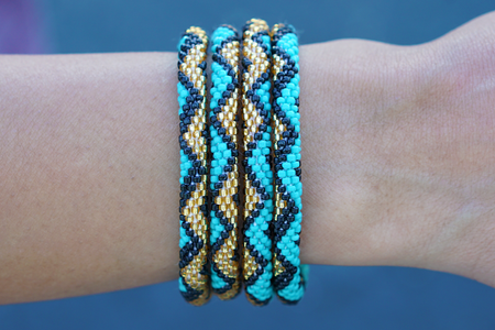 Handmade glass bead bracelet from Nepal, featuring a roll design. Also known as a beaded bracelet, seed bead bracelet, beach glass bracelet, or sea glass bracelet.