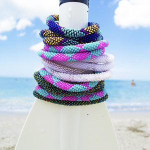 Handmade glass bead bracelet from Nepal, featuring a roll design. Also known as a beaded bracelet, seed bead bracelet, beach glass bracelet, or sea glass bracelet.
