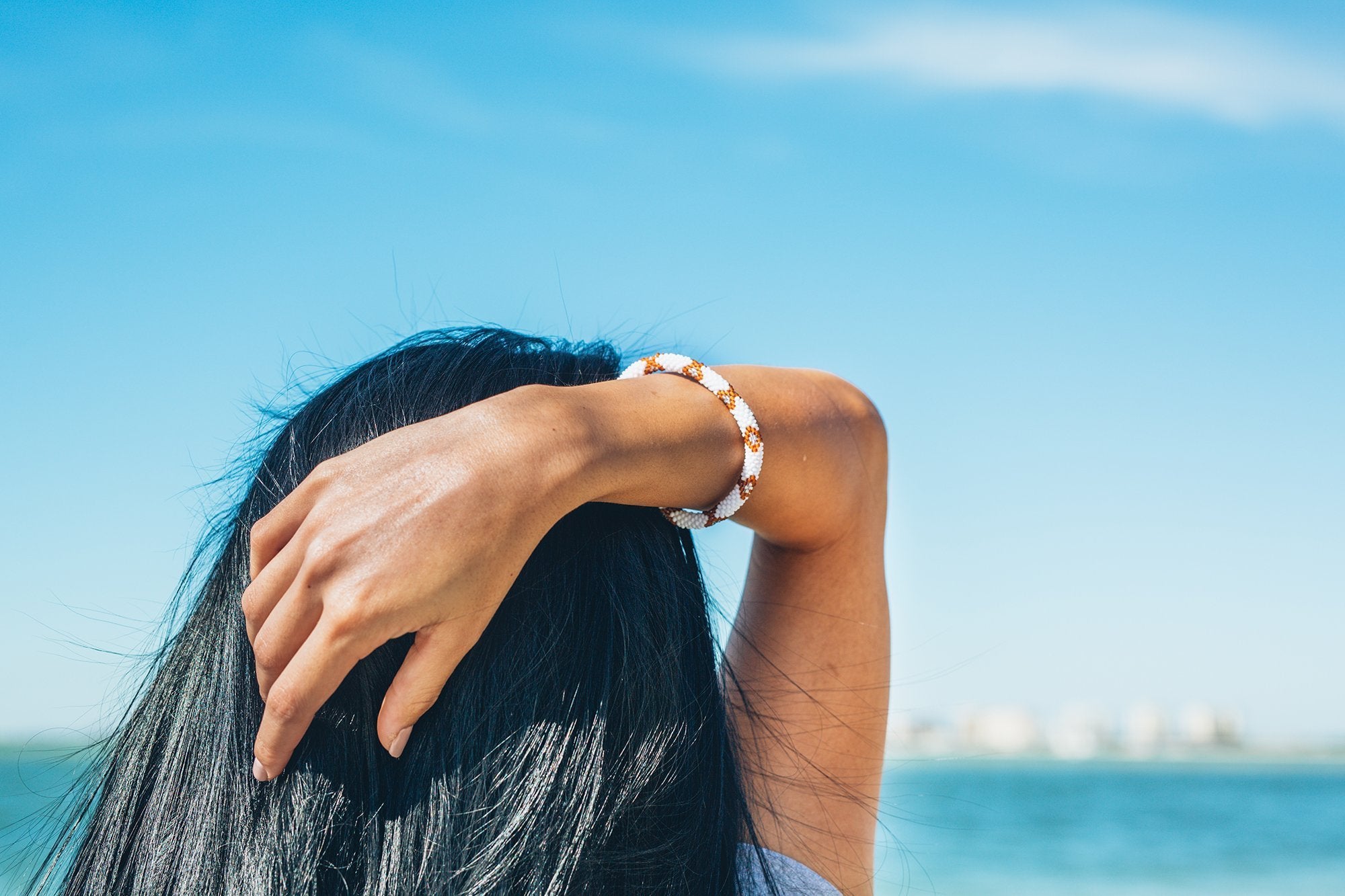 Handmade glass bead bracelet from Nepal, featuring a roll design. Also known as a beaded bracelet, seed bead bracelet, beach glass bracelet, or sea glass bracelet.
