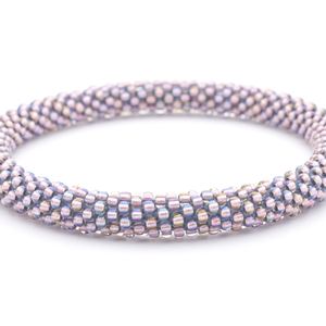 Handmade Beaded friendship bracelet with iridescent purple glass beads. Crafted by artisans in Nepal for Sashka Co. 