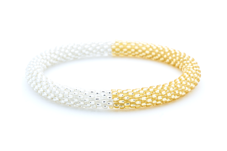 Handmade glass bead clear and champagne gold bracelet from Nepal, featuring a roll design. Also known as a beaded bracelet, seed bead bracelet, beach glass bracelet, or sea glass bracelet