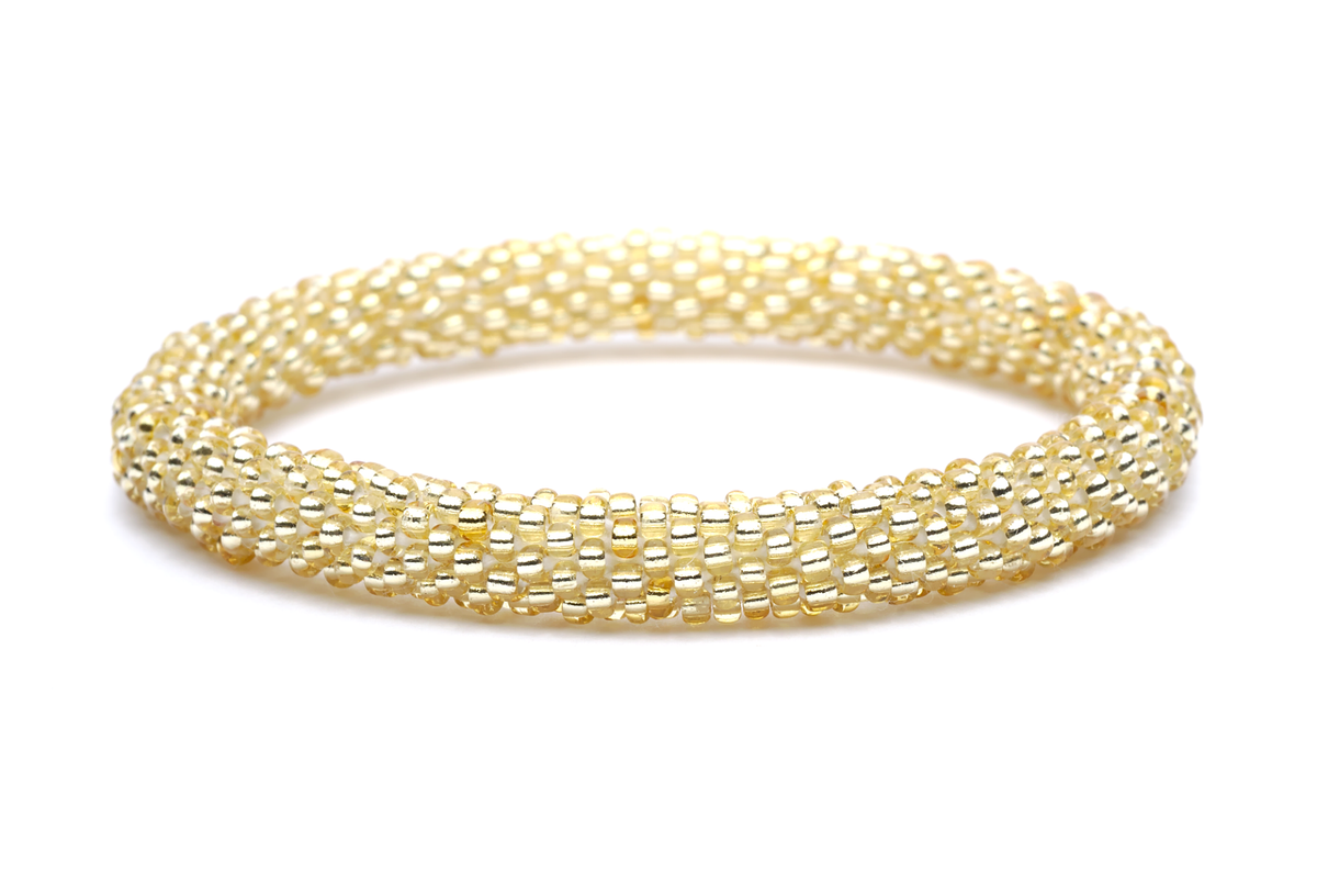 Handmade glass bead Champagne Gold bracelet from Nepal, featuring a roll design. Also known as a beaded bracelet, seed bead bracelet, beach glass bracelet, or sea glass bracelet