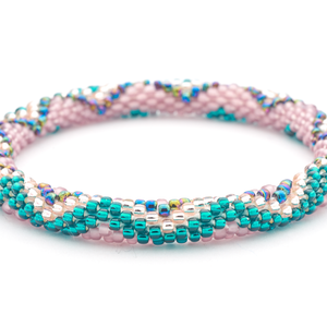Handmade glass bead Teal ,  Mauve , Rose Gold , Iridescent bracelet from Nepal, featuring a roll design. Also known as a beaded bracelet, seed bead bracelet, beach glass bracelet, or sea glass bracelet