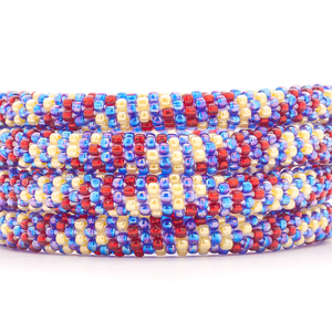 Handmade glass bead red, iridescent blue, yellow bracelet from Nepal, featuring a roll design. Also known as a beaded bracelet, seed bead bracelet, beach glass bracelet, or sea glass bracelet