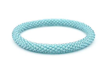Handmade glass bead solid turquoise teal bracelet from Nepal, featuring a roll design. Also known as a beaded bracelet, seed bead bracelet, beach glass bracelet, or sea glass bracelet